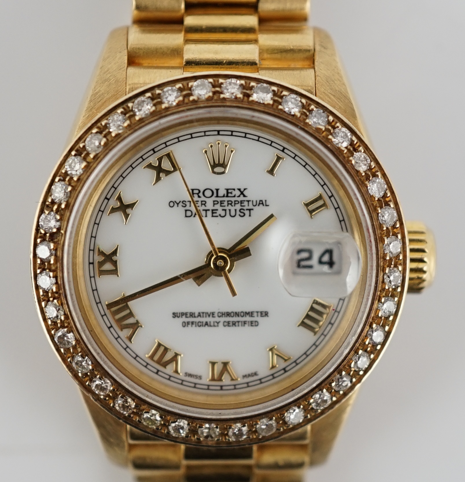A lady's 1990's 18ct gold Rolex Oyster Perpetual Datejust wrist watch, with after market diamond set bezel